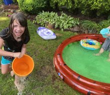 A kiddie pool and some buckets equal tons of backyard fun! Photo by Rose Gordon Sala 